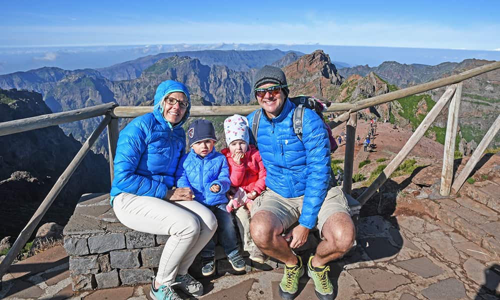 a family with young children at Pico Arierio mountain viewpoint in madeira