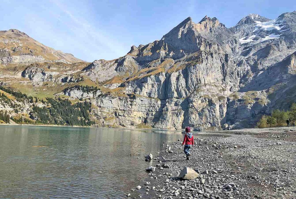 a boy at the Oeschinensee lake shore