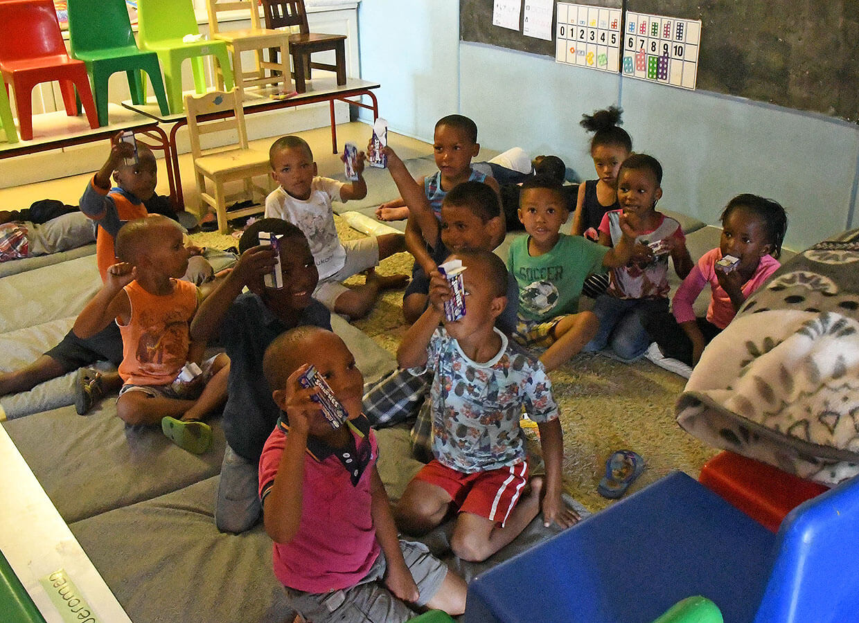 Children at the creche enjoying some sweets our kids wanted to give to them 