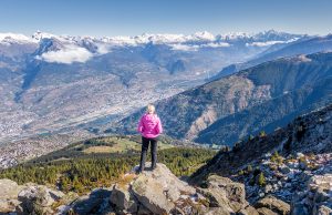 woman standing on top of mountain