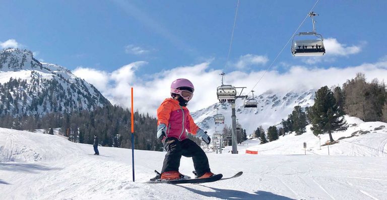 a girl skiing in Les 4 vallees Switzerland ski domain