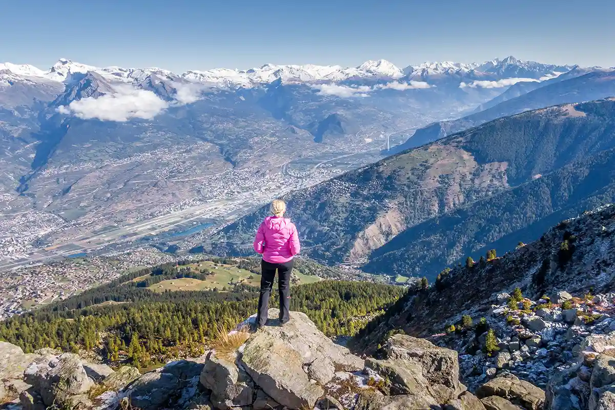 Woman on La Dent mountain in Nendaz, Valais during a Switzerland itinerary with mountain views