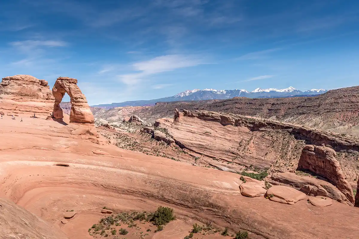 photo from the secret lookout in the Arches NP in Moab with snowy mountains in the back