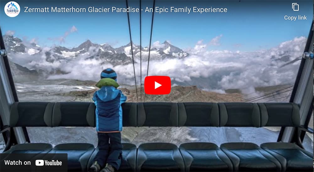 a boy sitting in the zermatt matterhorn glacier cable car looking out of the window