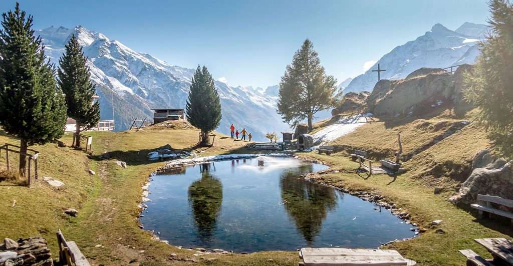 family at a mountain place Jungen Alp marvelling at the view