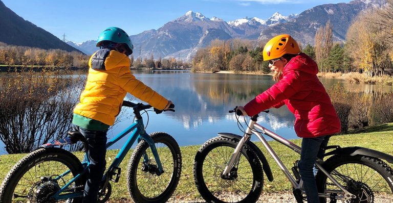 kind on their bike whilst biking in Switzerland