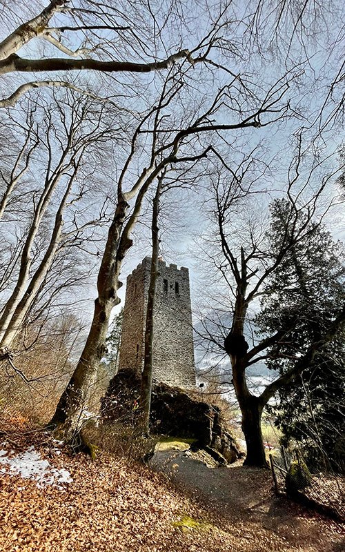A stone tower in the forest in Meiringen Haslital. the Restiturm
