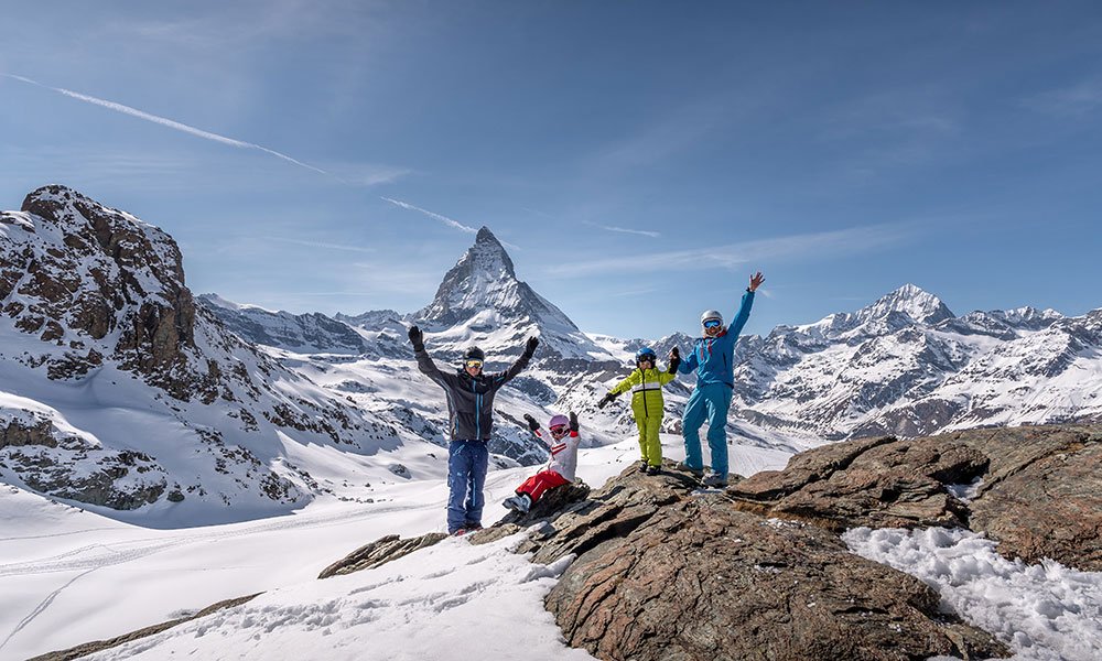 family at Rotenboden station in zermatt in winter 
