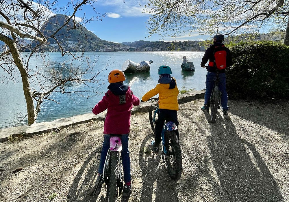 family on their bikes within Parc Ciani in Lugano