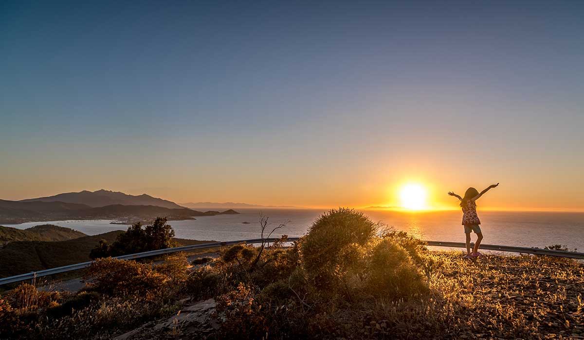 girl dancing in the sunset in Elba