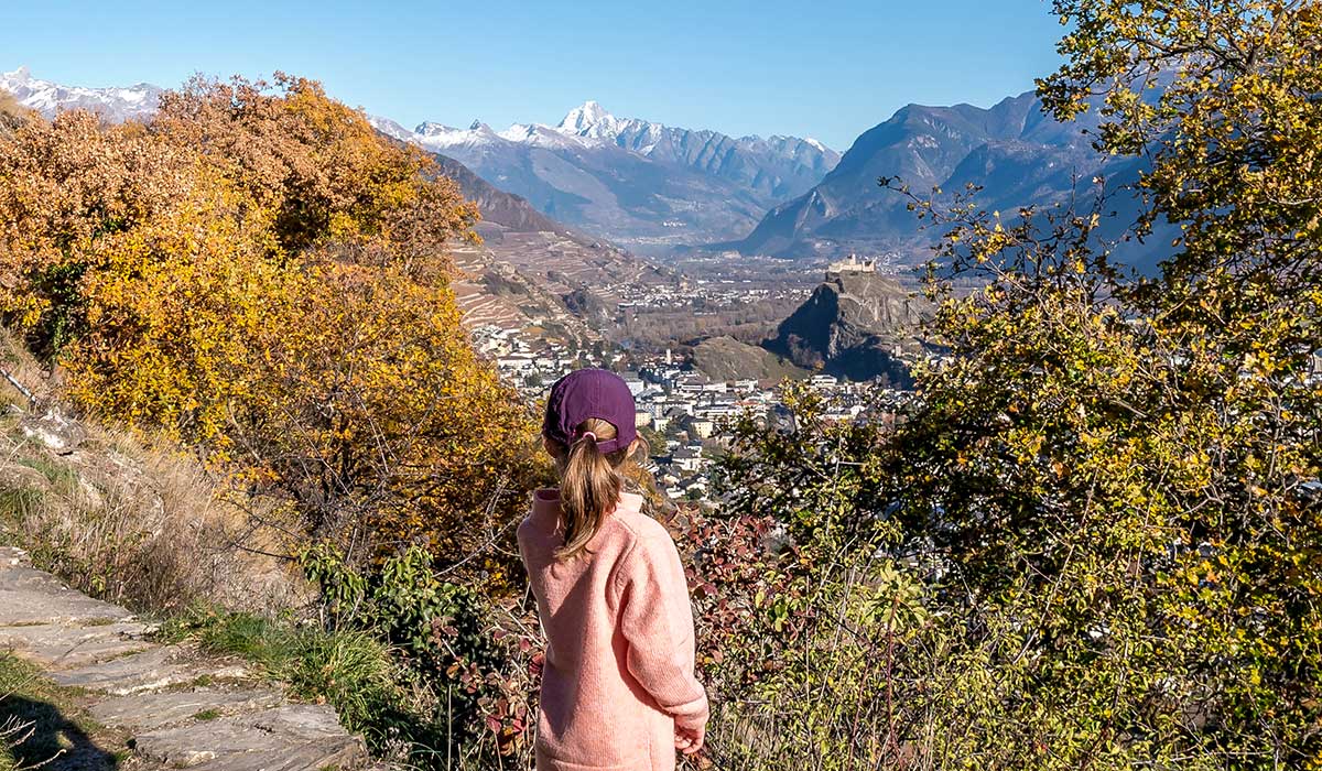 girl hiking along the siphon bisse in sion