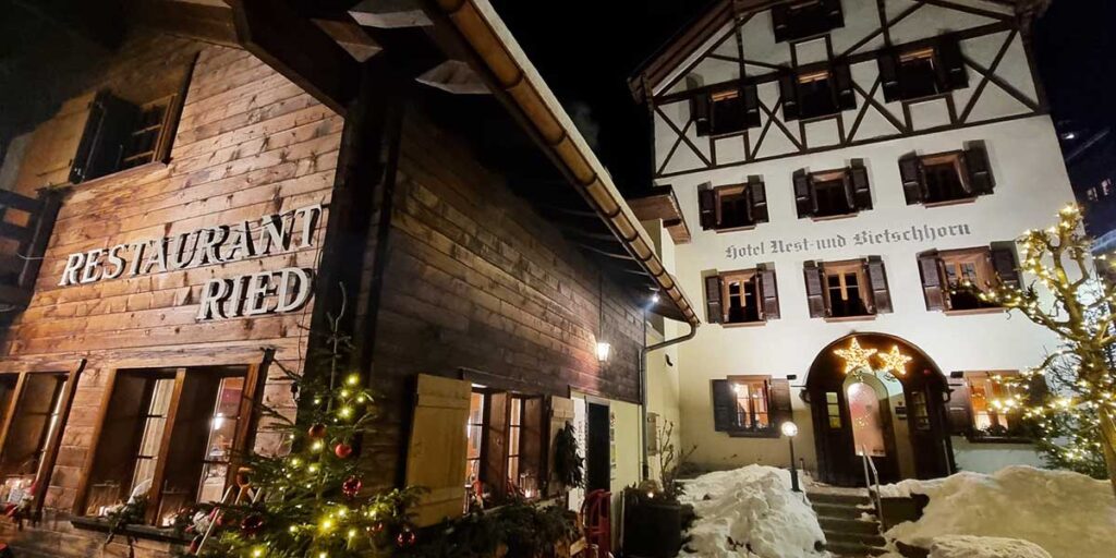 the hotel nest Bietschhorn in Lötschental illuminated with lights in the winter