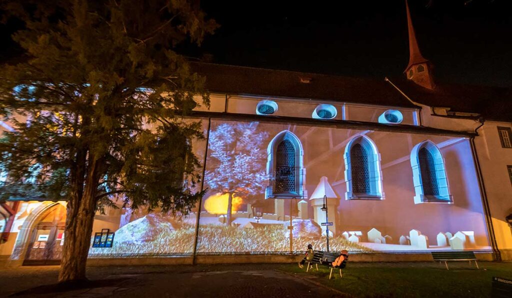 a light show on a church in Lucerne during the LILU