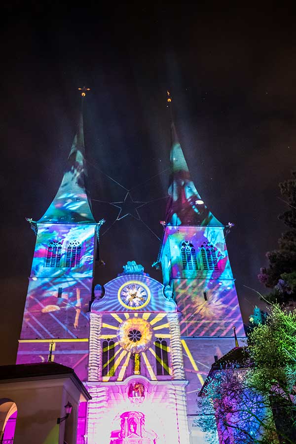 a church in lucerne illuminated beautifully