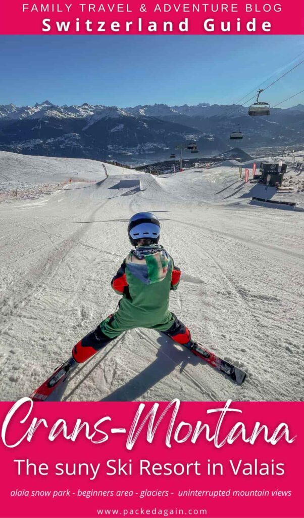 on a pin guide a boy getting ready for his jump in a snow park in Crans-montana