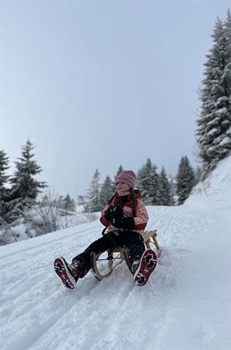 a girl on her sledge
