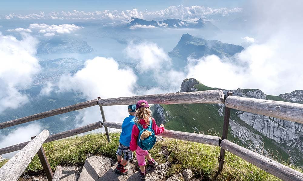 children looking down from mount Pilatus in Luceren pn the Golden round trip