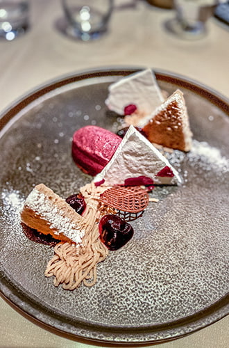 a dessert plate with vermicelli and ice cream on it
