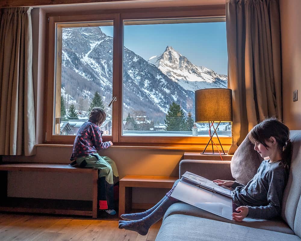 children sitting in the swiss peak resorts lounge in Zinal