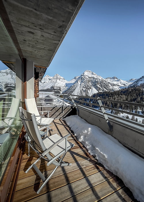 balcony view from a luxury hotel in Arosa in winter