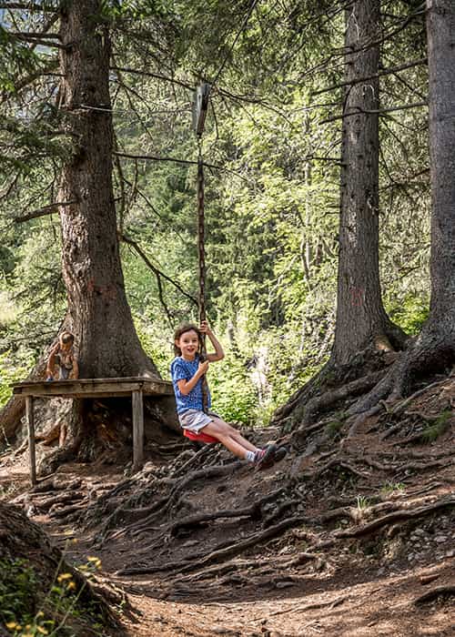 a girl at the zip line of the children's adventure trail from Allembdhubel to Mürren