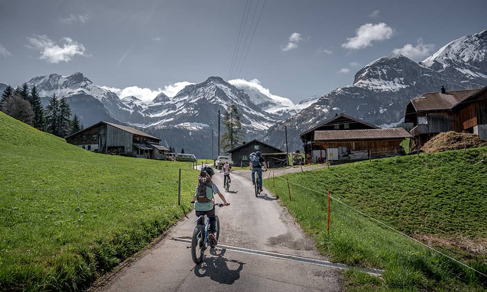 a family biking to Lake Lauenen