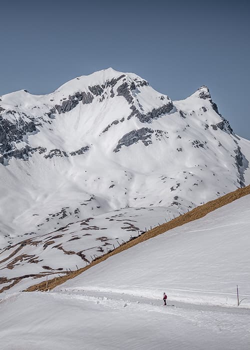 a girl in the far distance hiking to Bachalpsee i