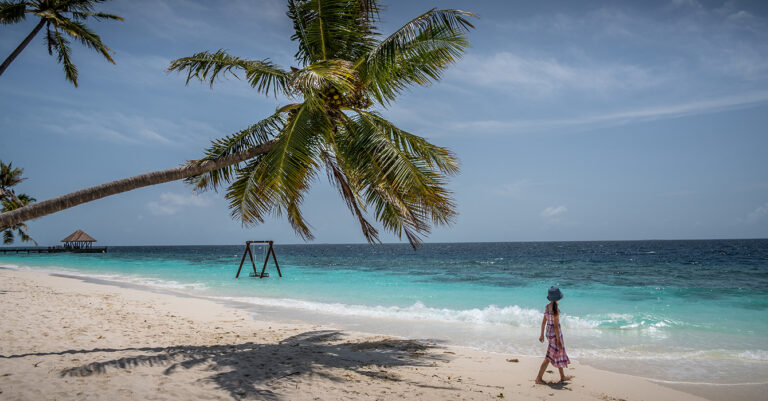 a girl walking on a Maldivian resort island