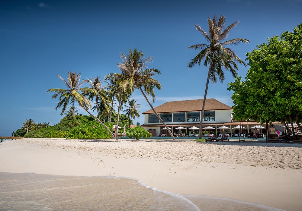 maldivaina beach with sports complex and pool at Reethi faru Maldives