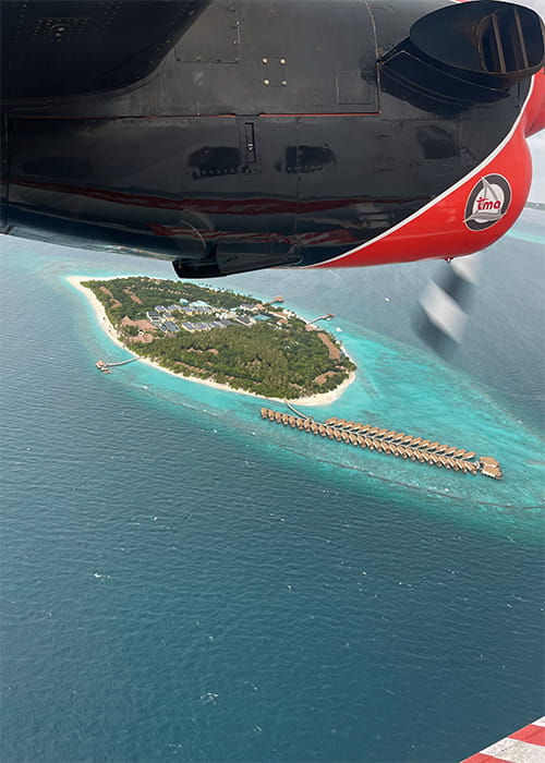 areal view out of a maldivain seaplane over Reethi Faru Island Resort Maldives