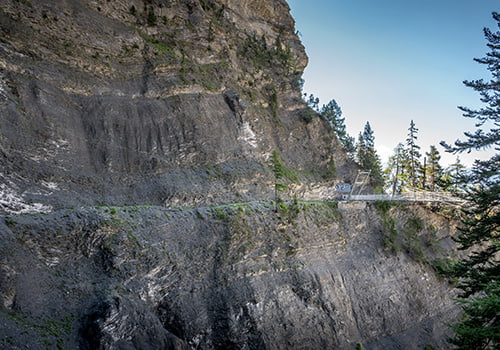 small narrow path along the mountain cliffs on the bisse du ro in Valais