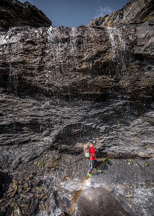 a boy behind a rainbow