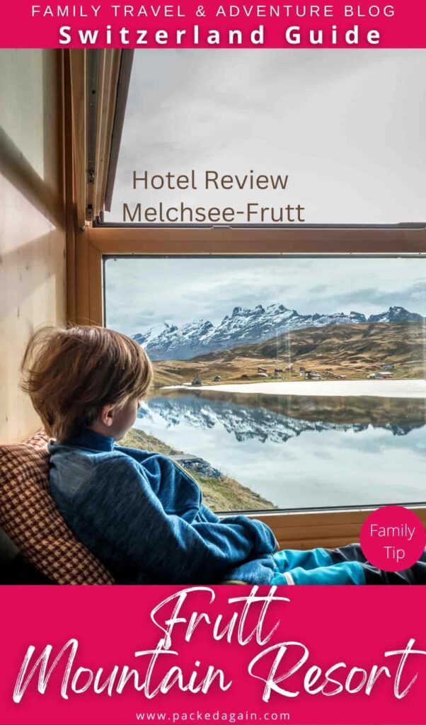 a boy sitting at a hotel window at Melchsee Frutt