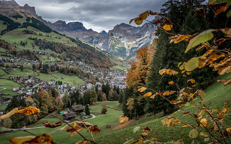 autumn view down to the village of Engelberg with mountains around it