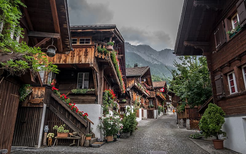 swiss village in brienz at the Brunnengasse where every house has beautiful flowers on it