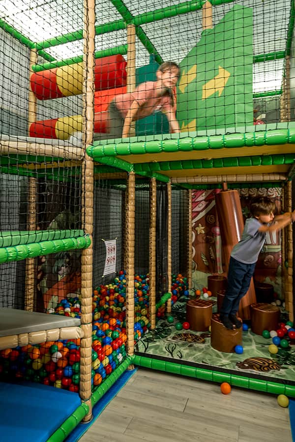 children playing in a ball room in a swiss hotel