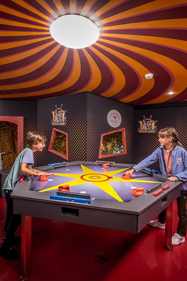 children playing at a air tennis table