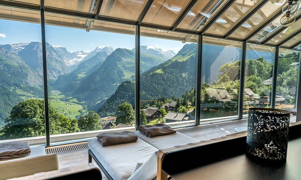 Spa area at Märchenhotel Braunwald with panoramic mountain views in Glarus