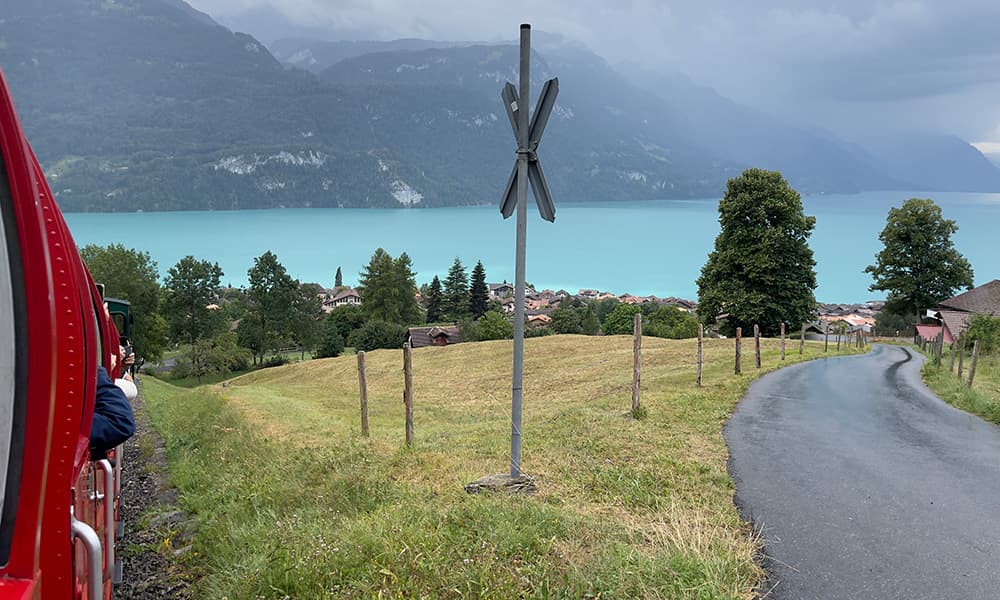 the red Brienzer Rothorn train with Lake Brienz in the background