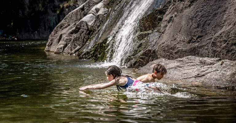 children swimming in valley Maggia