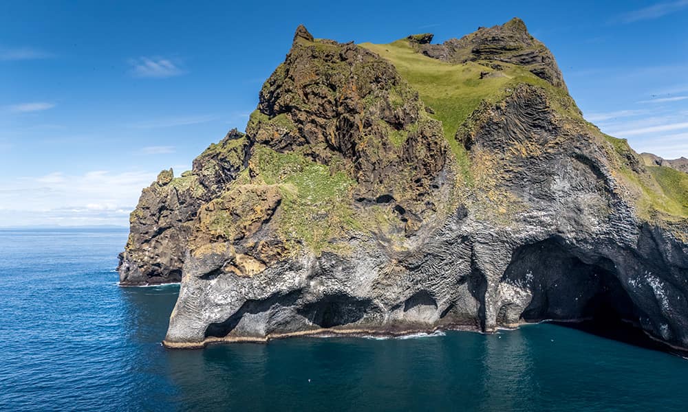 rock formation looking like an elephant in the water on the Icelandic island Heimaey of the Westman Islands