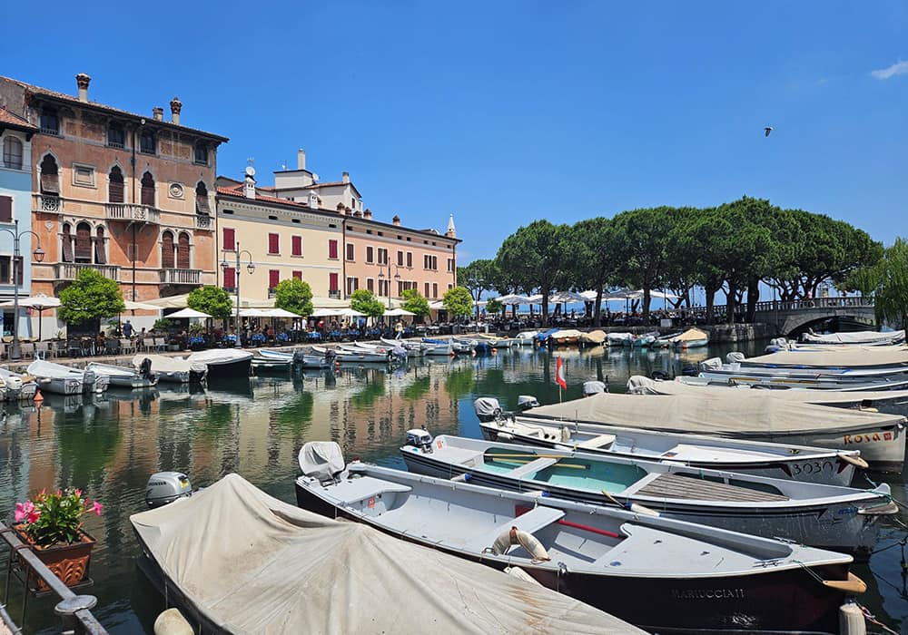 fishing boats in the harbour at Lake Garda on a suny day