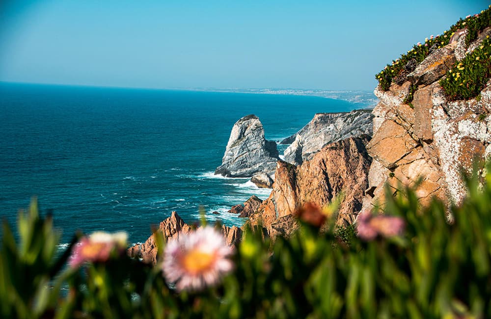 view over Praia das Macas beach with rocky formation in Portugal