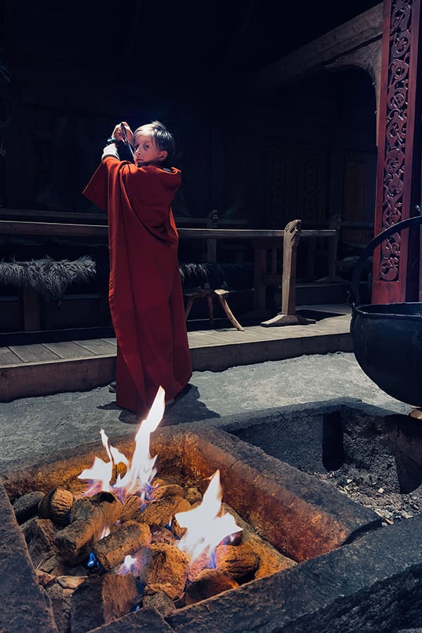 in the Viking museum in Lofoten by an open fire pit