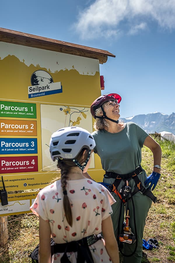 mother and daughter with climbing gear ar braunwald seilpark