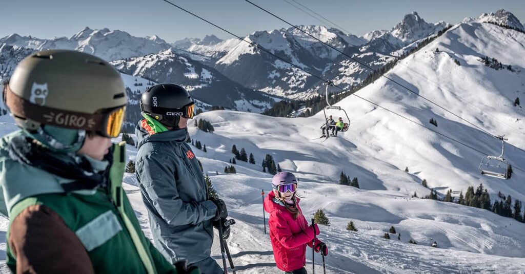 Family in Gstaad on the slops laughing at the funny name of the ski piste