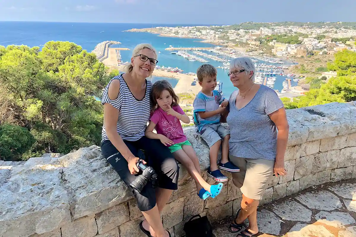 family with senior travelling in italy