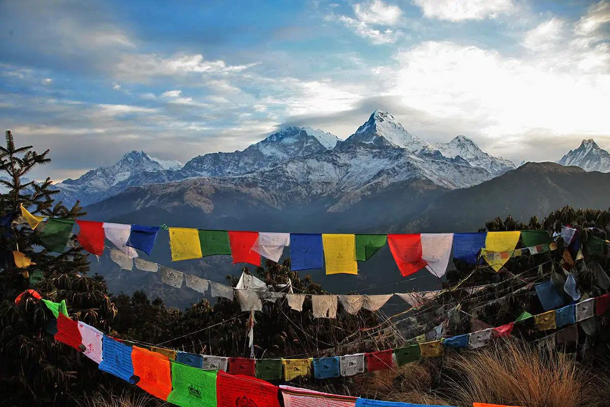 Nepaly prayer flags hanging infron of the nepaly mountains on the way to the Everest Base Camp